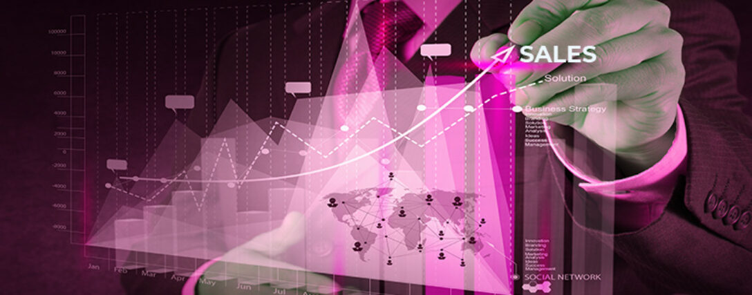 A person in a suit draws an upward arrow on a transparent screen showing sales growth graphs and interconnected global networks. The words 