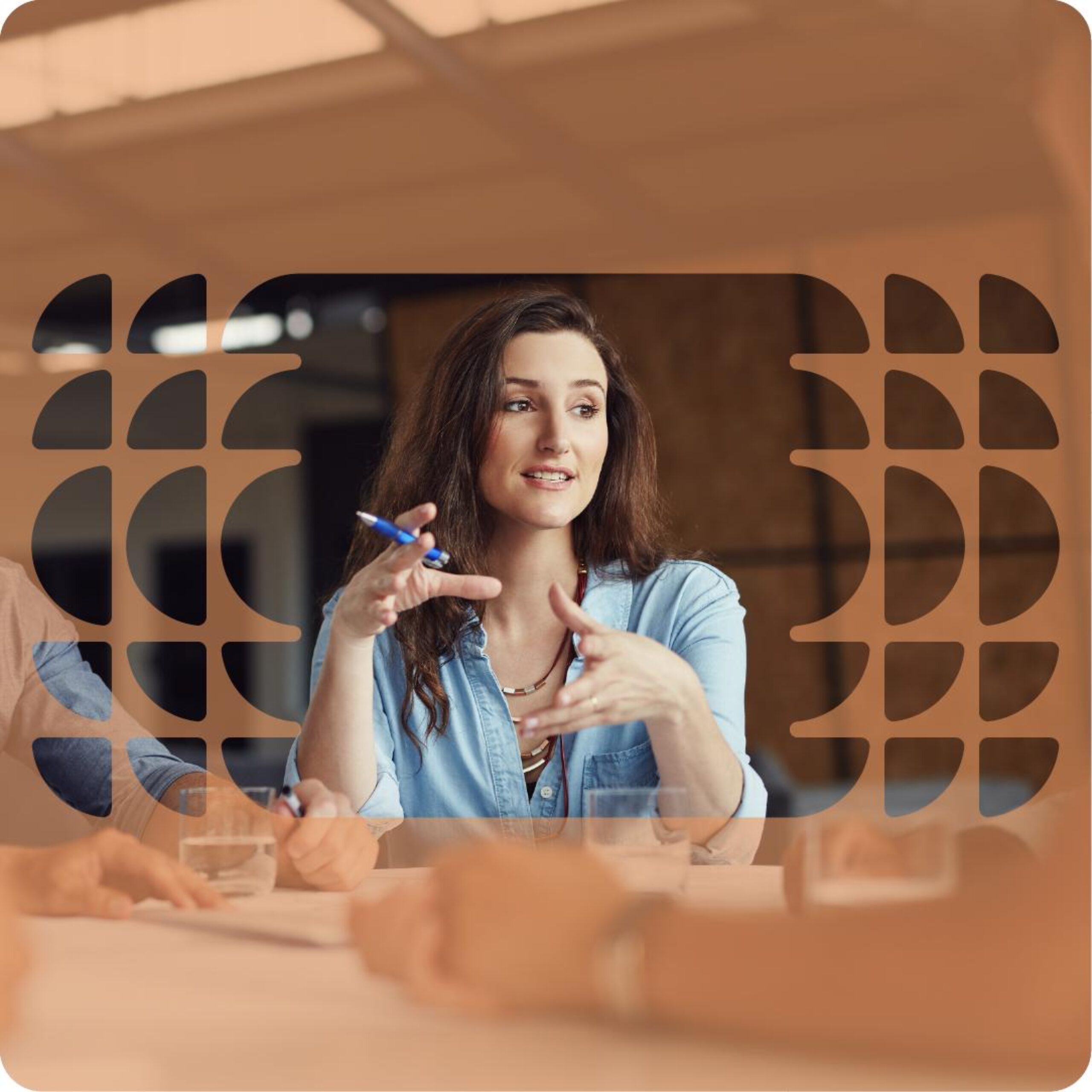A woman in a blue shirt gestures while explaining the value of dynamic 3D layouts.