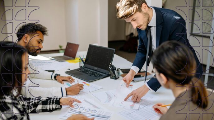 A group of business people analyze sustainability reports.