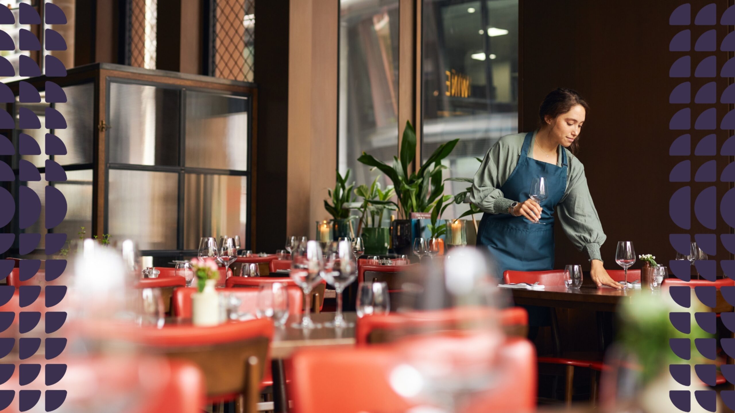 Female waitress setting tables